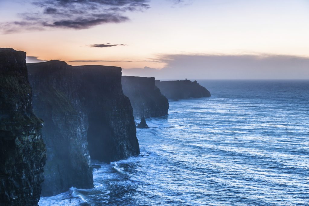 Famous cliffs of Moher at sunset in Co. Clare Ireland Europe. Beautiful landscape natural attraction.